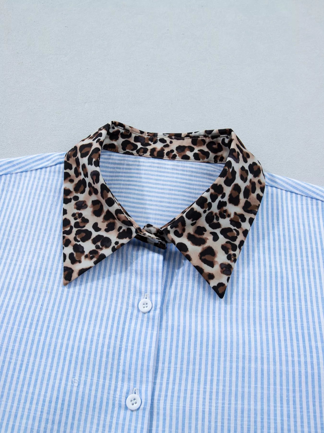 Women's leopard print short sleeve dress with contrast collar by Plush Fashion Hub, featuring a stylish animal print and classic collar detail.