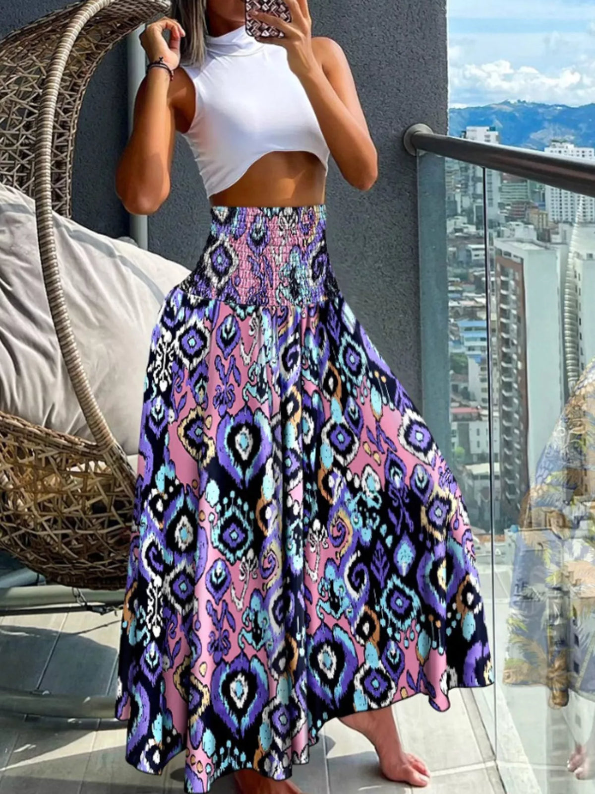 Printed wide-leg pants by Plush Fashion Hub, featuring a colorful floral pattern and flowing fabric for a stylish, comfortable look.