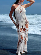 Cutout halter neck cover-up dress by Trendsi, featuring a stylish design with cutout details and a halter neckline.