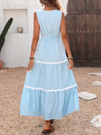Striped sleeveless tiered midi dress by Trendsi featuring bold horizontal stripes and a flowing, layered design.