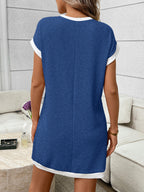 Ribbed knit mini dress with contrast trim and functional pocket, trendy dress by Trendsi featuring a fitted silhouette and stylish details.