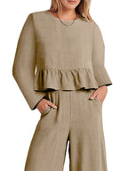 Women's ruffled hem long sleeve top and pants lounge set with pockets, stylish two-piece set by Trendsi, shown in soft fabric.