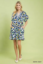 Umgee polka dot print tunic dress featuring a relaxed fit, long sleeves, and a stylish round neckline, perfect for casual wear.
