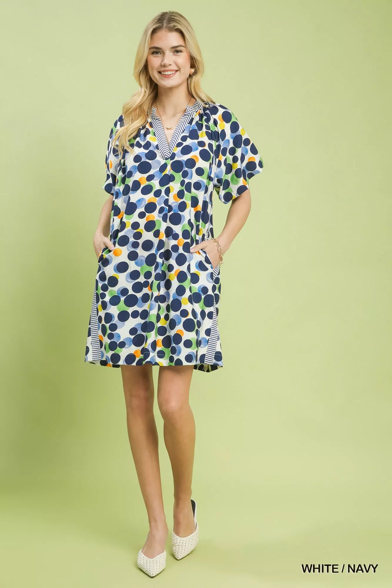 Umgee polka dot print tunic dress featuring a relaxed fit, long sleeves, and a stylish round neckline, perfect for casual wear.