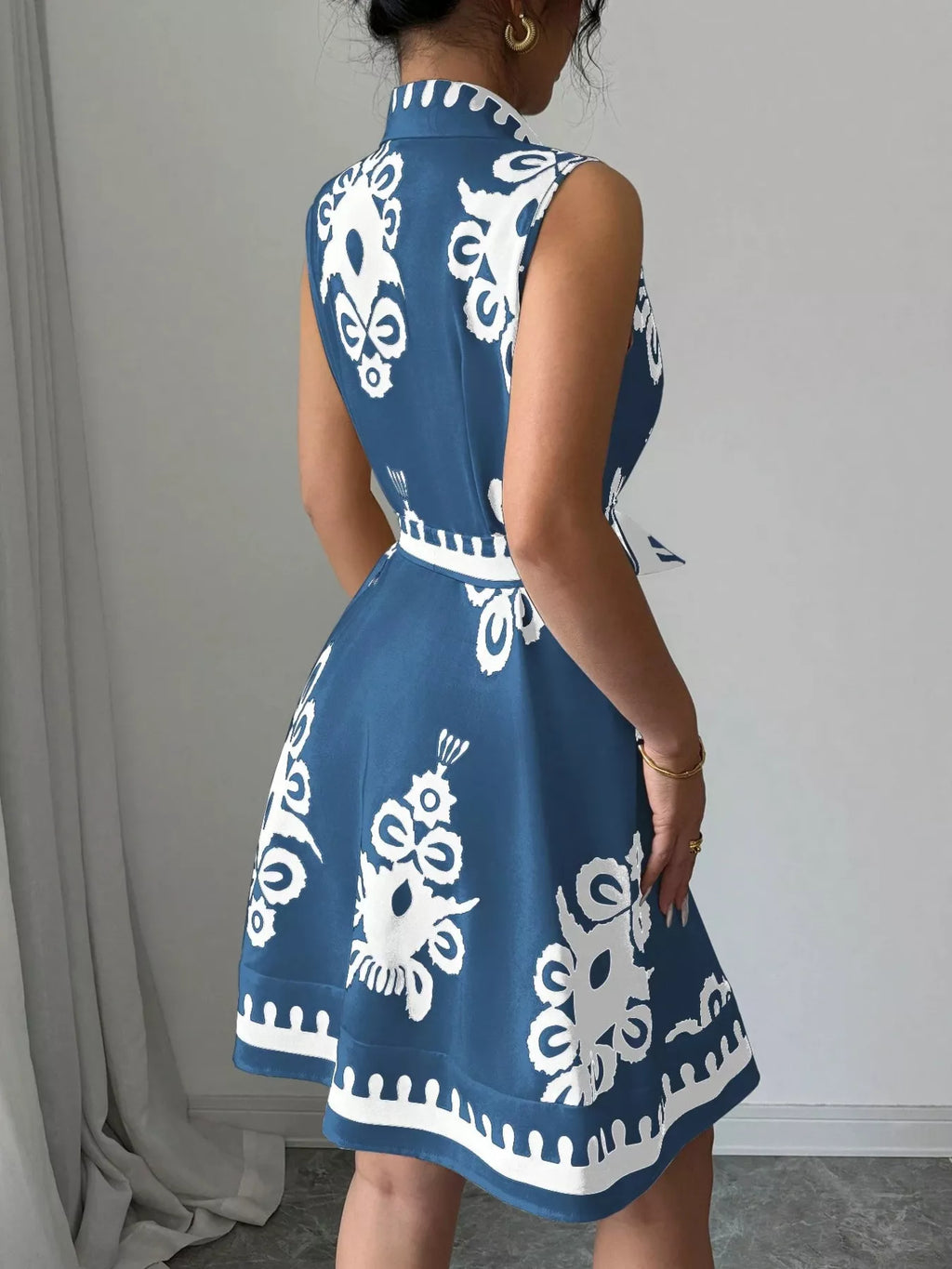 Sleeveless ruched printed tie waist dress by Shopimist, featuring a stylish design with a flattering fit and vibrant pattern.