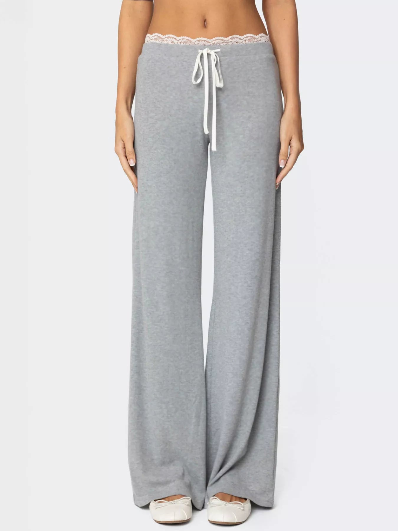 Women's wide-leg lounge pants with lace trim and tie waist, stylish and comfortable Trendsi pants for relaxed wear.