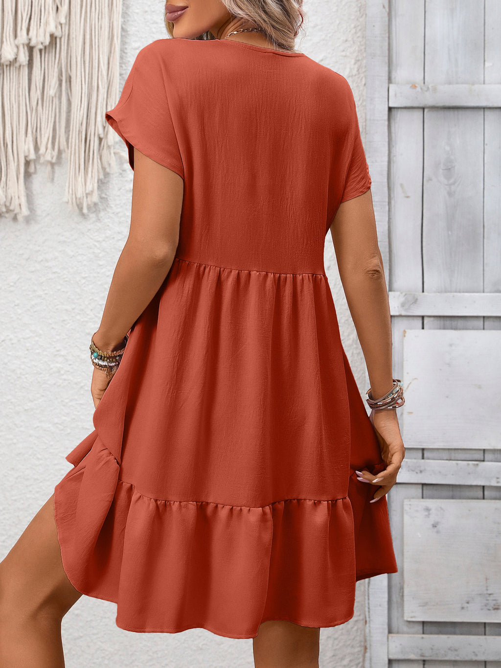 Women's casual V-neck mini dress with ruffle hem and ruched detailing, featuring a relaxed fit and stylish design.