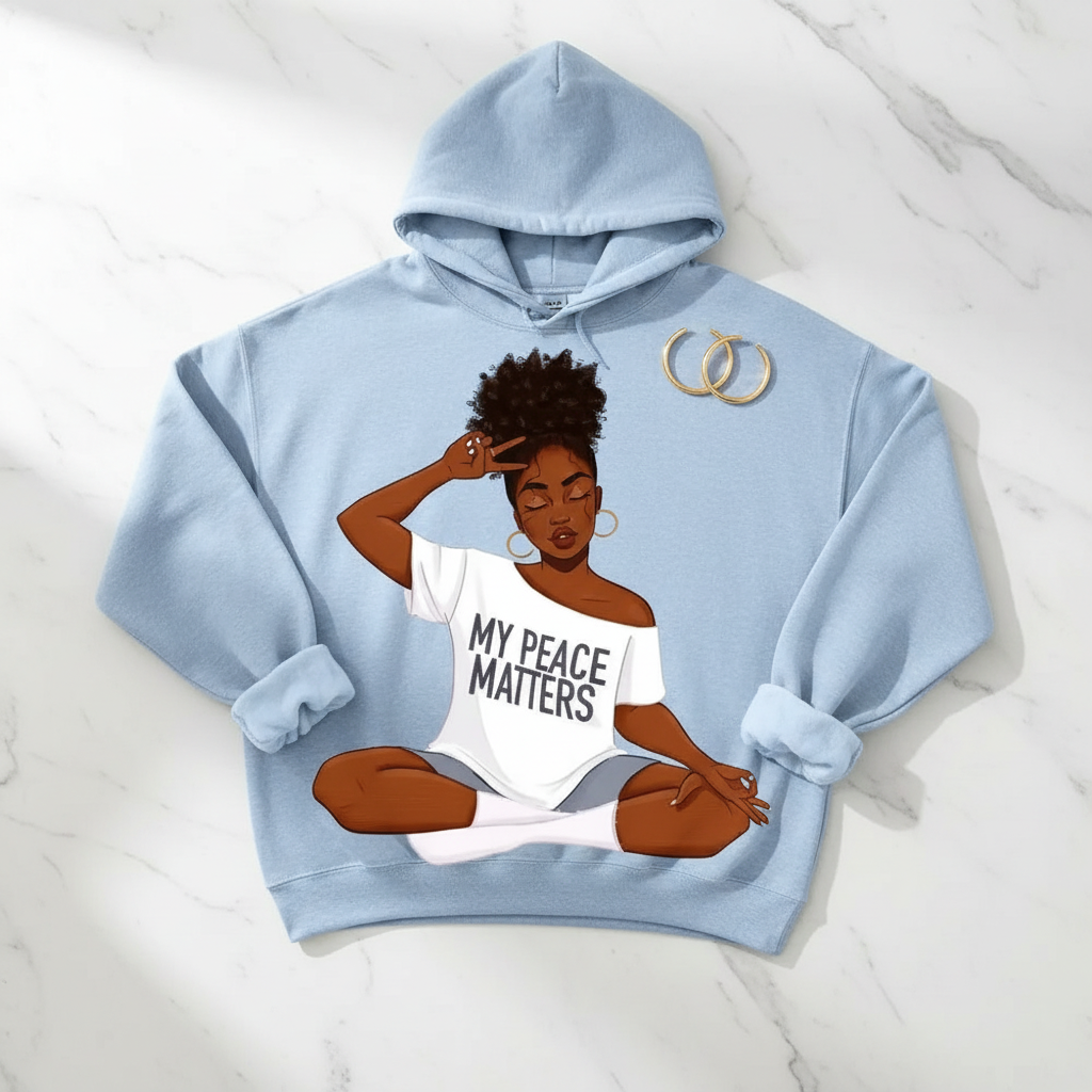 Light blue cotton hoodie featuring a graphic of a meditating Black woman with "MY PEACE MATTERS" text.
