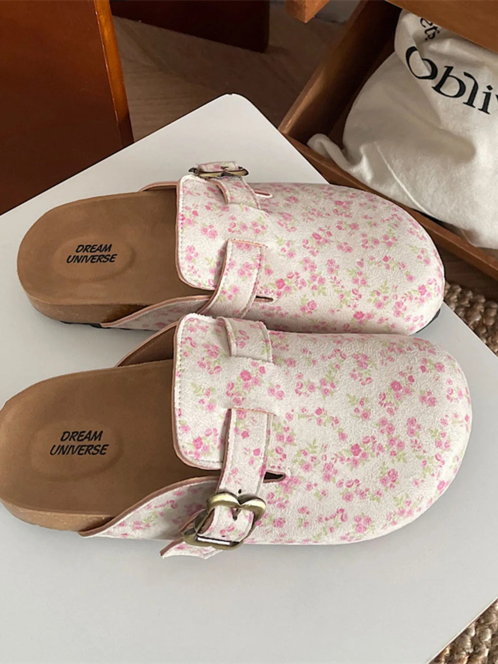 Women's floral print round toe slip-on flats, casual comfortable walking shoes by Trendsi, with a colorful floral pattern and easy slip-on design.