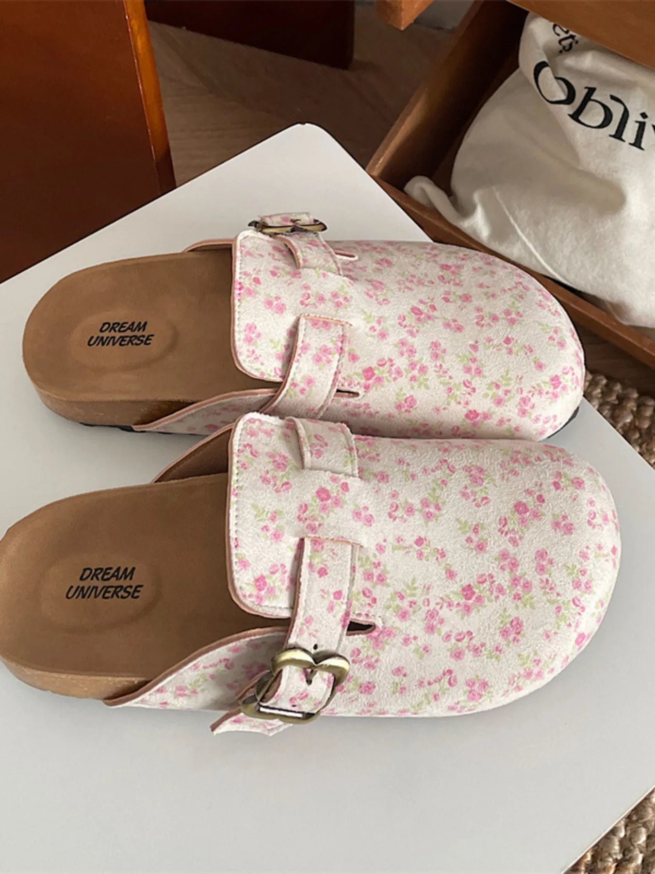 Women's floral print round toe slip-on flats, casual comfortable walking shoes by Trendsi, with a colorful floral pattern and easy slip-on design.