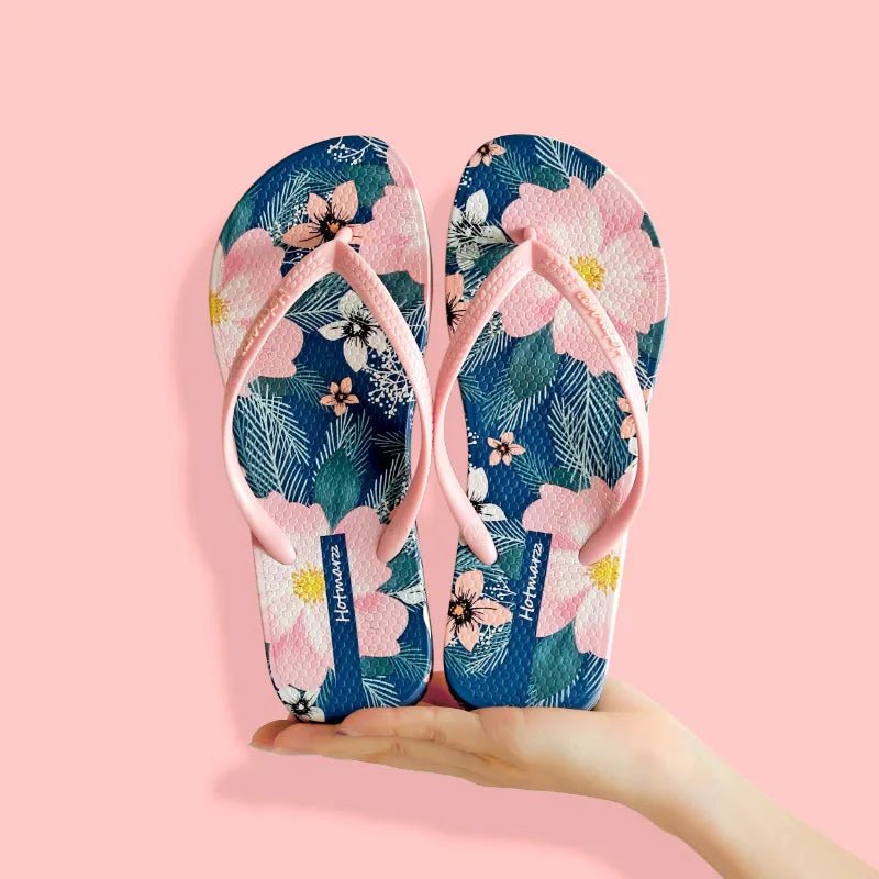 Women's floral print toe post flat sandals by Trendsi, comfortable summer beach slides with colorful floral design.