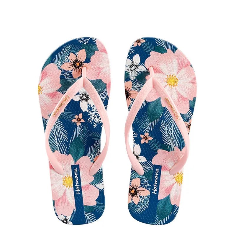 Women's floral print toe post flat sandals by Trendsi, comfortable summer beach slides with colorful floral design.