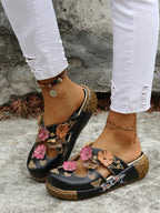 Floral round neck flat sandals from Trendsi, made of premium PU leather, featuring a colorful floral design for summer footwear.