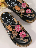 Floral round neck flat sandals by Trendsi with premium PU leather, featuring colorful floral design for elegant summer footwear.