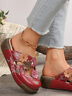 Floral round neck flat sandals in premium PU leather, stylish summer footwear with floral accents and comfortable flat sole.