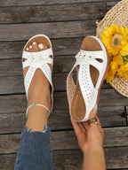 Women's floral comfort wedge sandals by Trendsi, stylish low heel shoes with floral design and soft PU leather for casual wear.