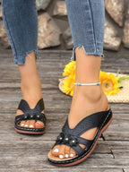 Women's floral comfort wedge sandals with low heel in PU leather, stylish and versatile for casual or dressy wear.