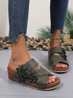 Women's floral crisscross wedge sandals with a comfortable mid-heel design, perfect for summer wear.