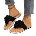 Women's floral toe post flat sandals made of premium faux leather with colorful flower accents, stylish and comfortable footwear.
