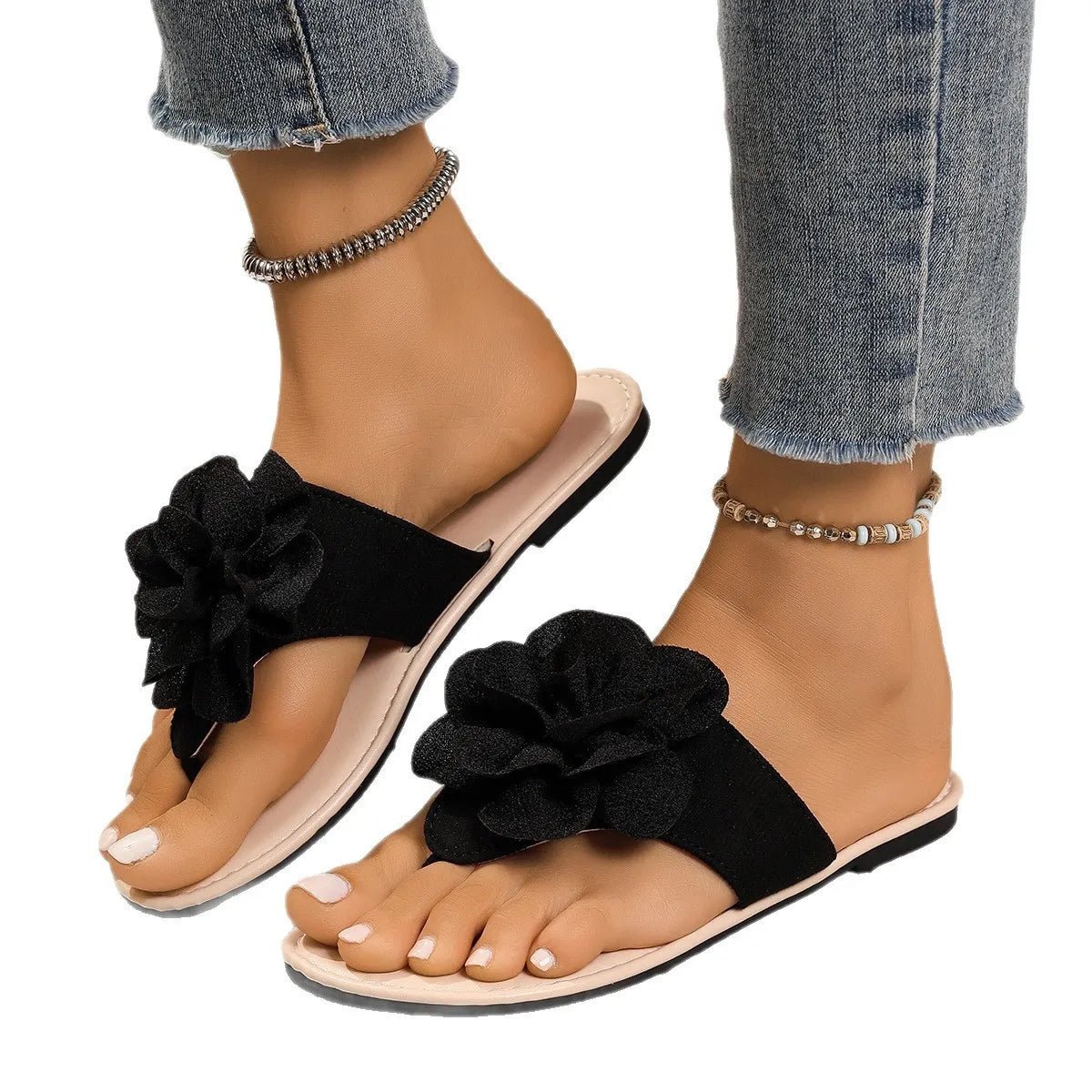 Women's floral toe post flat sandals made of premium faux leather with colorful flower accents, stylish and comfortable footwear.