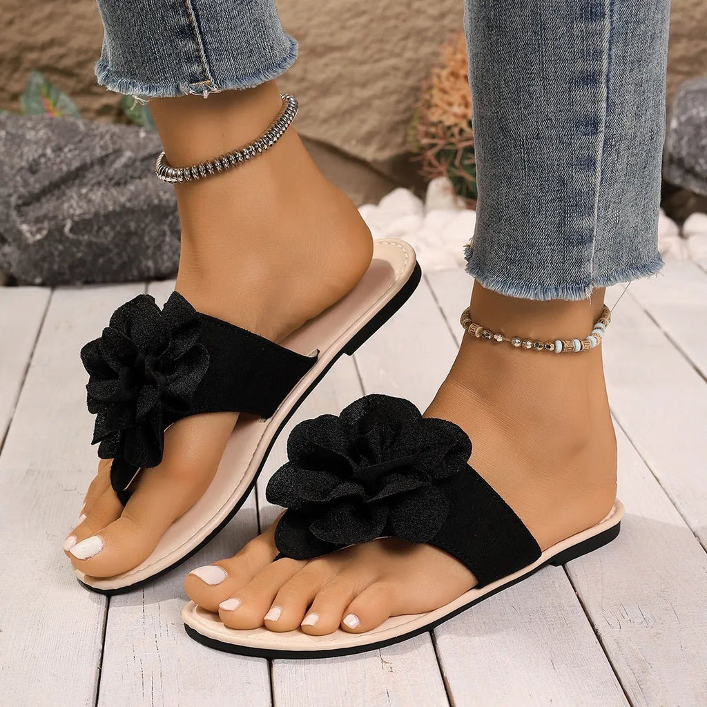 Women's floral toe post flat sandals in premium faux leather with colorful flower accents, casual summer footwear.