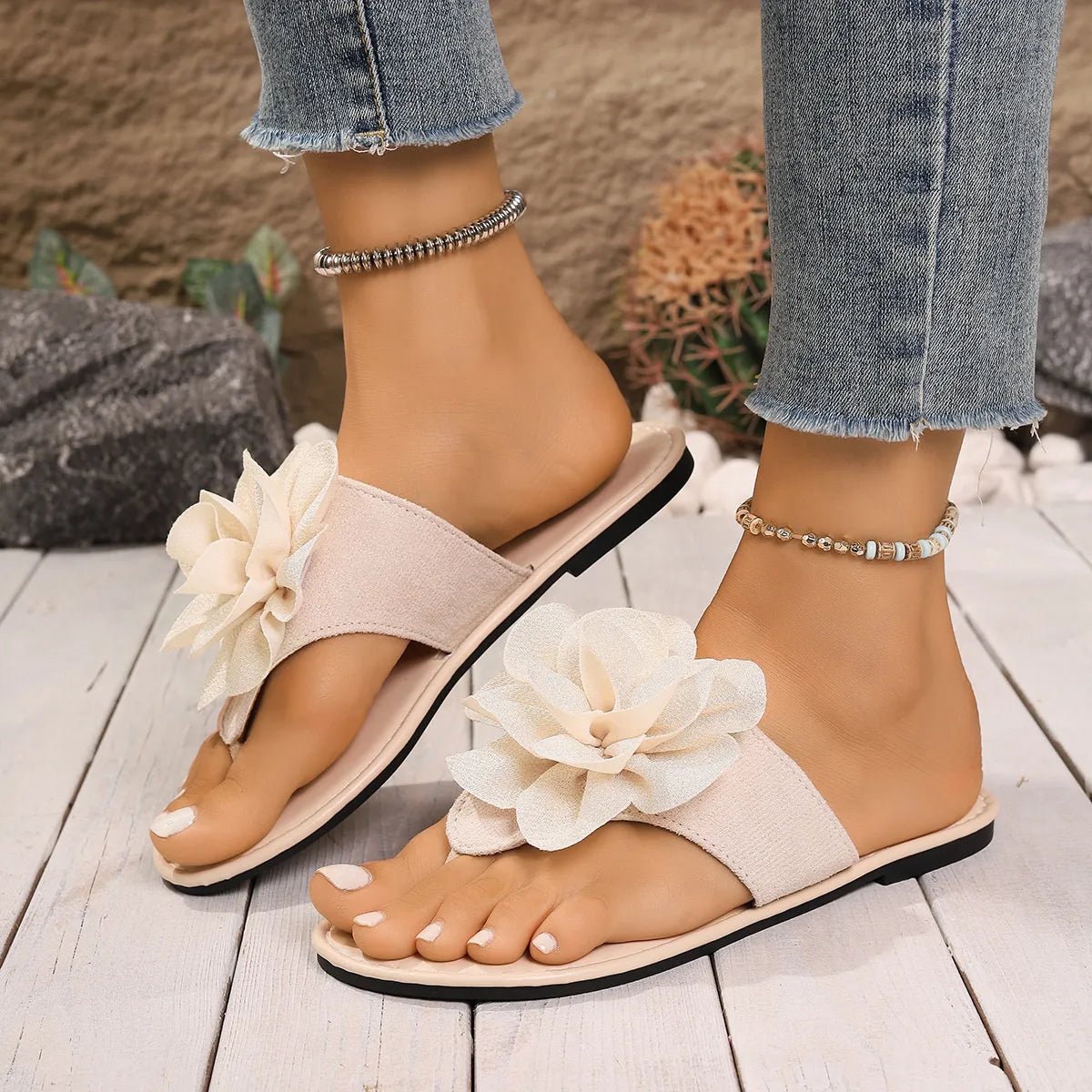 Women's floral toe post flat sandals in premium faux leather with colorful flower accents, stylish and comfortable footwear by Trendsi.