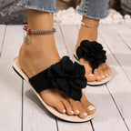 Women's floral toe post flat sandals in premium faux leather with colorful flower accents, casual summer footwear by Trendsi.