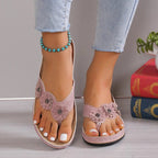 Floral toe post sandals by Trendsi featuring comfortable PU leather straps and a low heel, perfect for summer wear.