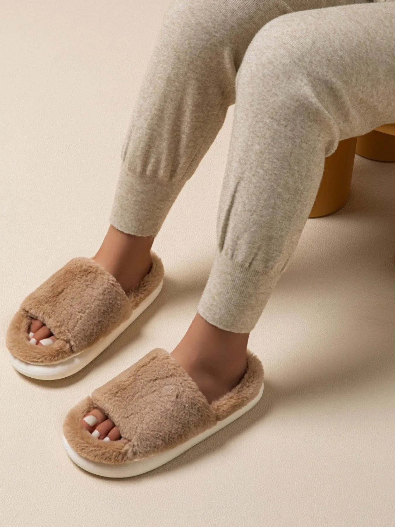 Soft plush open-toe faux fur slippers for women, cozy indoor house shoes with fluffy comfort from Trendsi.