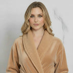 Front view of a small beige women's plush bathrobe by Plush Fashion Hub, showcasing its soft, cozy fabric and relaxed fit.