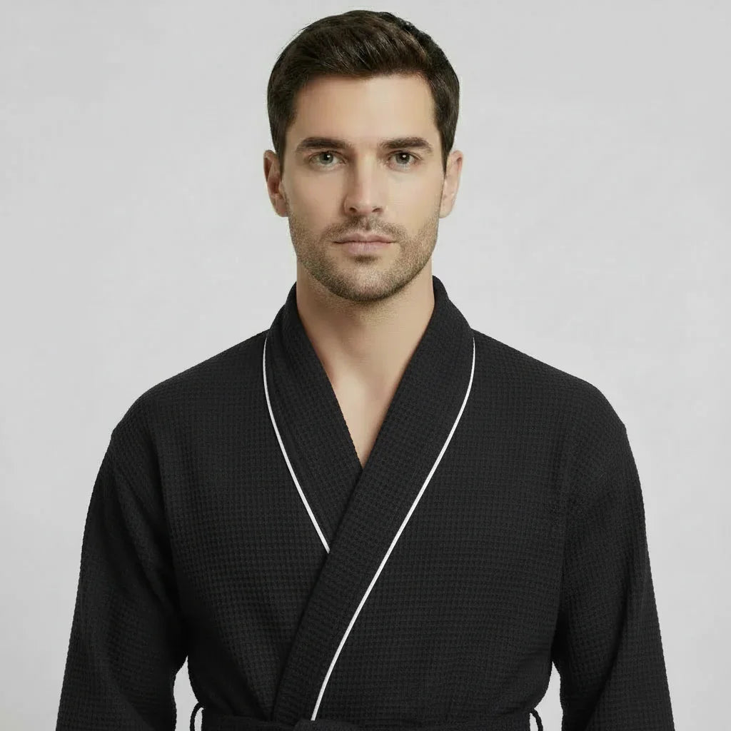 Front view of Plush Fashion Hub men's premium waffle piping robe in small black, showcasing cozy fabric and piping details.