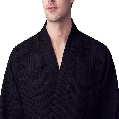 Front view of Plush Fashion Hub men's black waffle spa bathrobe, lightweight and absorbent for comfortable post-shower wear.