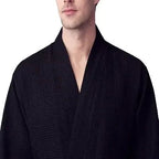 Front view of Plush Fashion Hub men's black waffle spa bathrobe, lightweight and absorbent for comfortable post-shower wear.