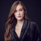 Front view of a small black women's plush bathrobe from Plush Fashion Hub, showing soft, cozy fabric and relaxed fit.