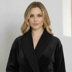 Women's ultra-soft plush bathrobe in black from Plush Fashion Hub, showing the front view with a cozy, plush texture.