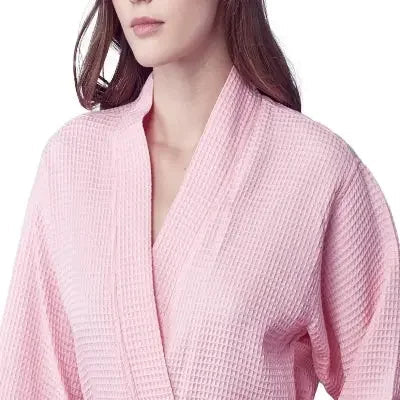 Front view of Plush Fashion Hub women's knee-length blush waffle robe, soft and cozy for lounging and relaxation.
