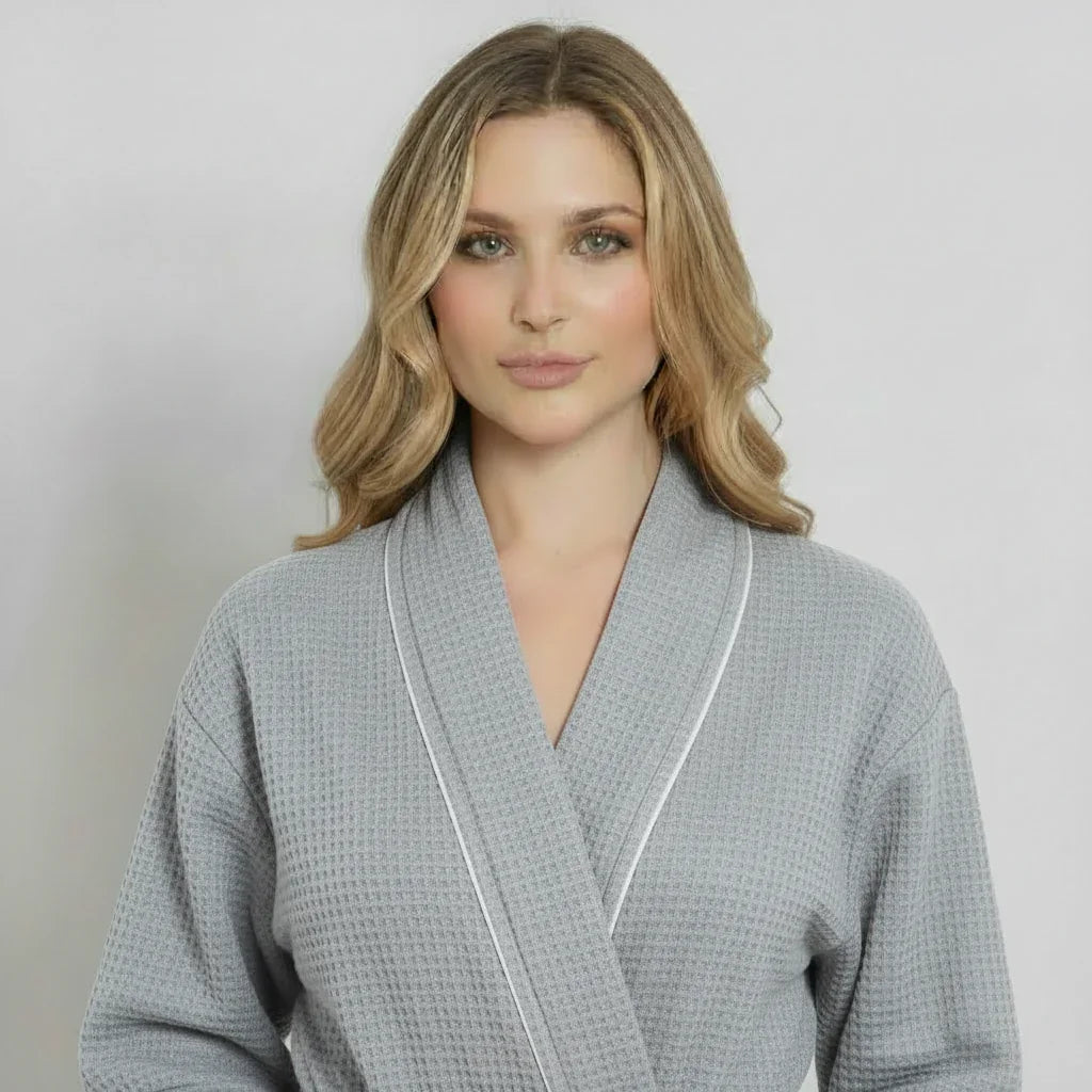 Gray knee-length waffle robe for women by Plush Fashion Hub, featuring piping and a cozy front view.