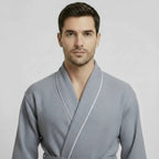 Front view of men's gray plush piping robe from Plush Fashion Hub, showcasing its cozy design and detailed piping accents.