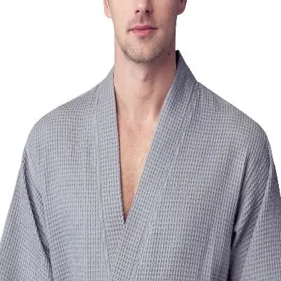 Small grey men's waffle spa bathrobe from Plush Fashion Hub, lightweight and absorbent, shown from the front.