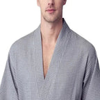 Small grey men's waffle spa bathrobe from Plush Fashion Hub, lightweight and absorbent, shown from the front.