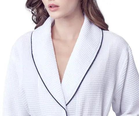 White women's waffle piping bathrobe from Plush Fashion Hub, lightweight spa-style robe with front design and piping details.