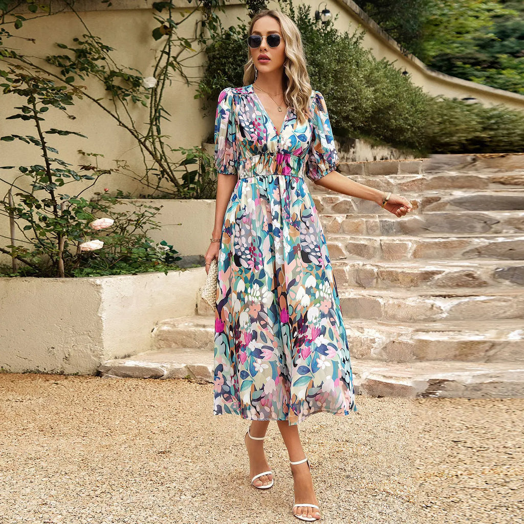 Women’s summer floral V-neck dress by Dukun Design featuring a flowy fabric and vibrant floral pattern.