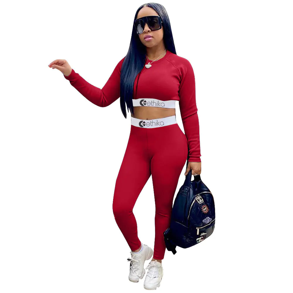 Women's two-piece sports set with letter print from Trendy Attic Store01, featuring a matching top and bottom in athletic style.