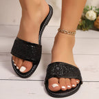 Women's glitter open toe flat sandals from Trendsi with sparkling embellishments, comfortable summer footwear for casual wear.