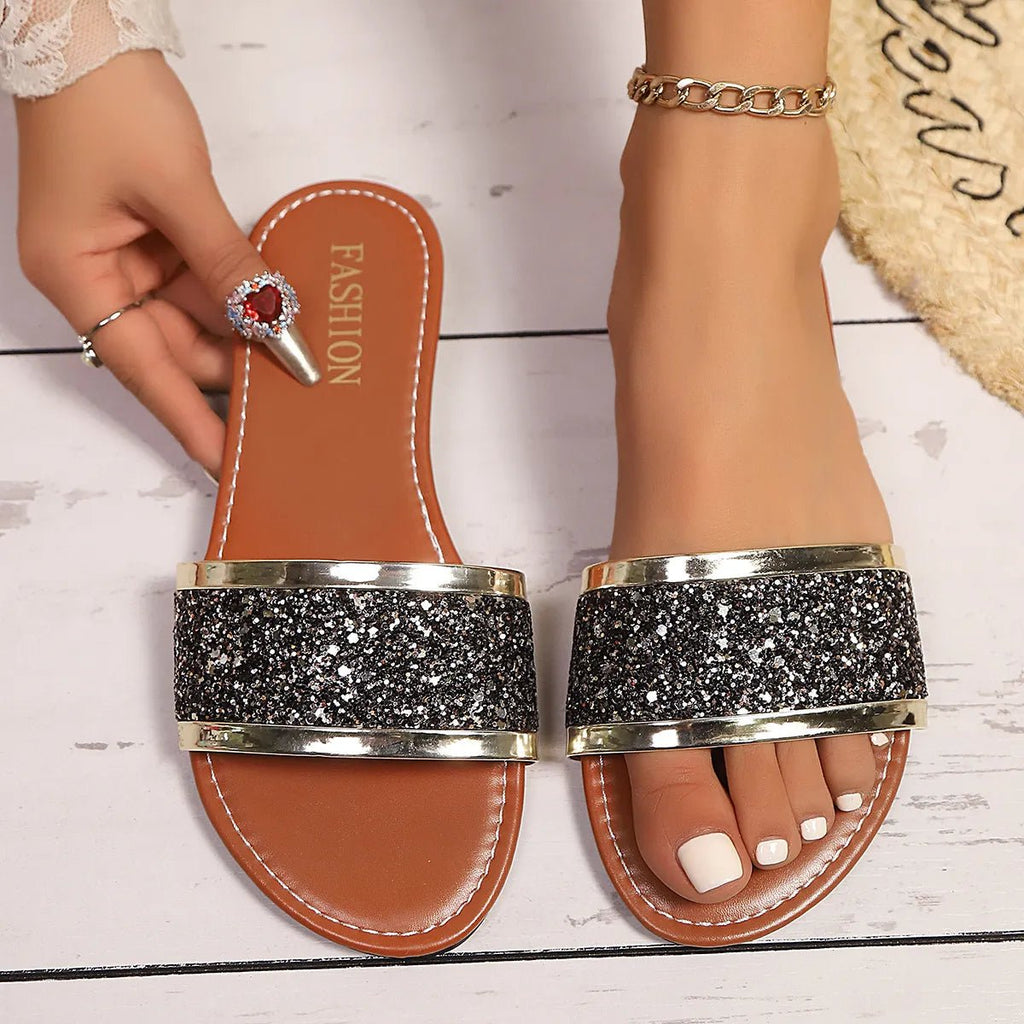 Women's glitter open-toe flat sandals by Trendsi featuring sparkling decoration and comfortable flat sole for summer wear.