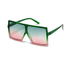 Green sunglasses Style 1669 from The House of Stylez with round frames and tinted lenses, stylish eyewear for sunny days.