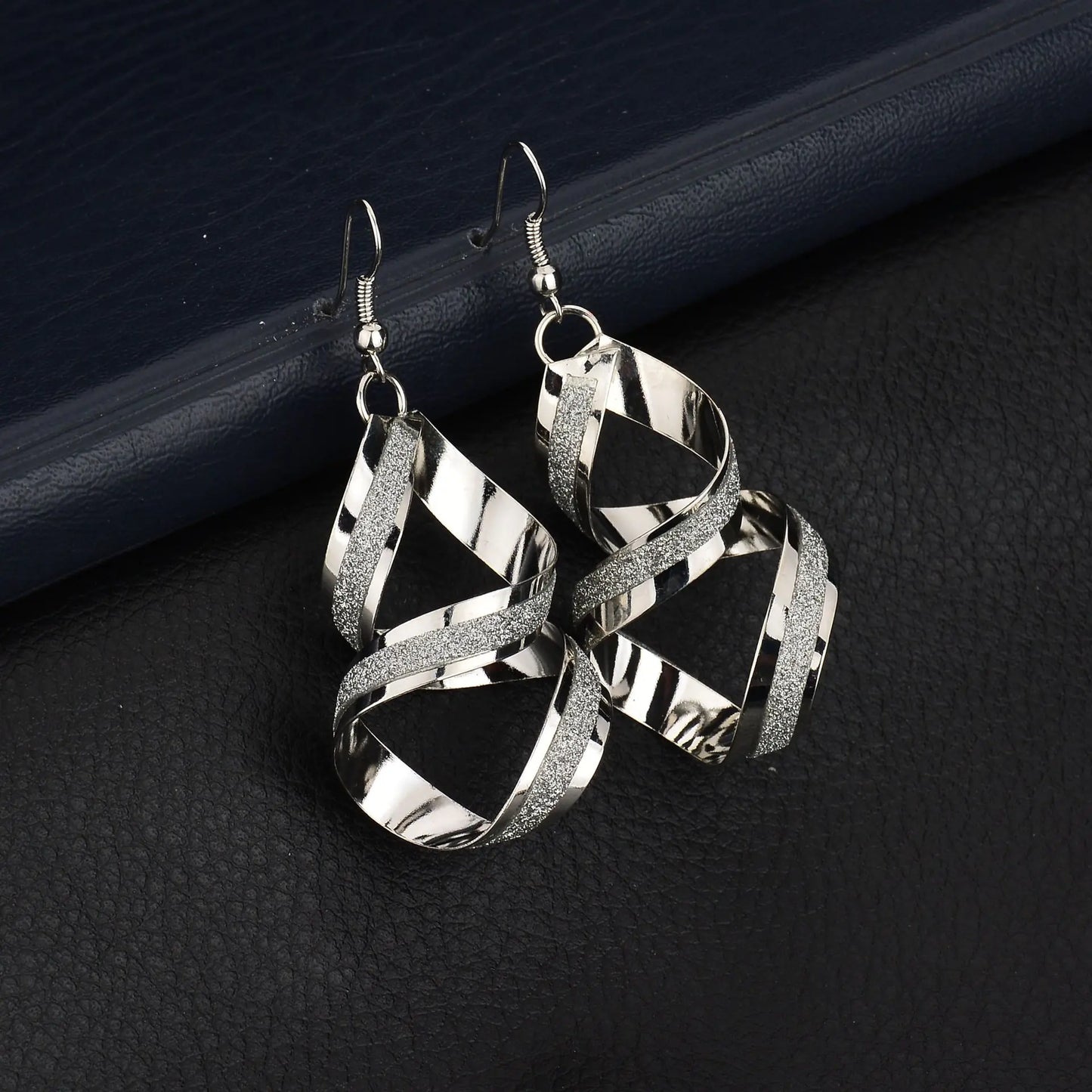 Silver trendy fashion earrings and studs from Plush Fashion Hub, featuring stylish metallic designs and sleek finishes.