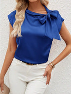 Bella Mia satin women's T-shirt with a half-open collar and bow detail, featuring a special interest design and sleek satin finish.