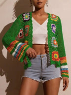 Hand-crocheted knitted women's cardigan in soft yarn, featuring a cozy design and button-up front from Plush Fashion Hub.