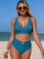 High-waisted ruched two-piece bikini set with cutout detail, trendy swimwear by Trendsi, displayed on a model